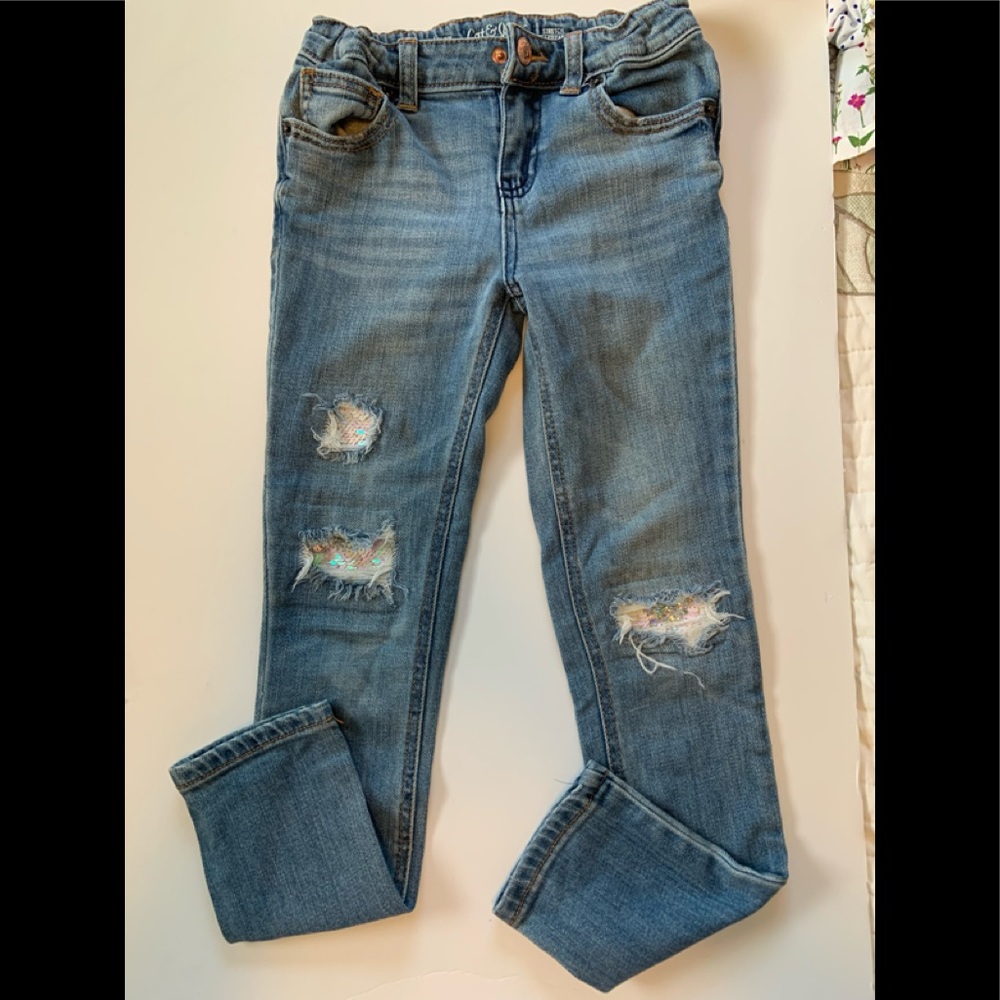 Sequined ripped jeans, adjustable waist.